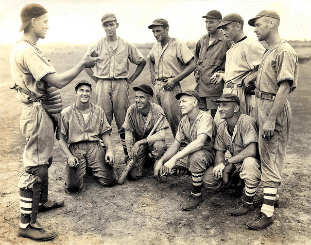 GI Baseball team in the South Pacific. More than likely, these men are either USMC or Navy personnel. The reverse of this image has hand-inscribed list of names of the players pictured.